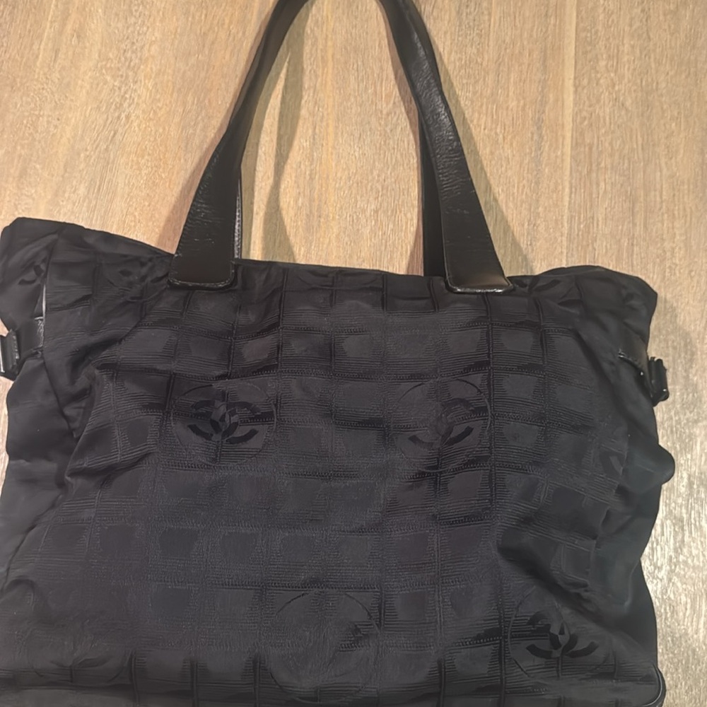 Chanel Black travel line bag
